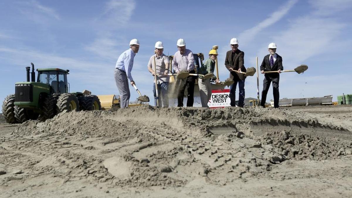 Current and former members of the Richland School board throw dirt during a groundbreaking ceremony for the district’s fourth middle school in West Richland at the intersection of Keene Road and Belmont Boulevard. The school, opening in August 2017, will be 108,00 square feet in size and house 800 students.
