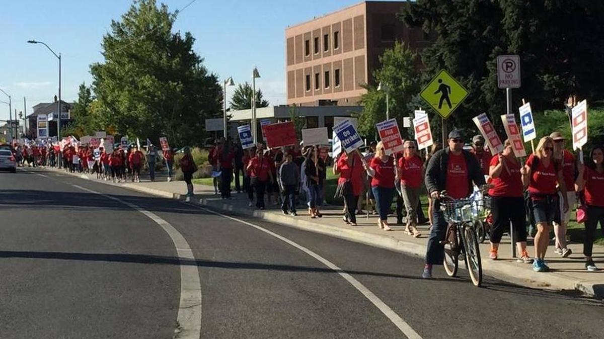 
Striking Pasco teachers walk down Fourth Avenue in Pasco on their way Friday to the Franklin County Courthouse for a hearing.
