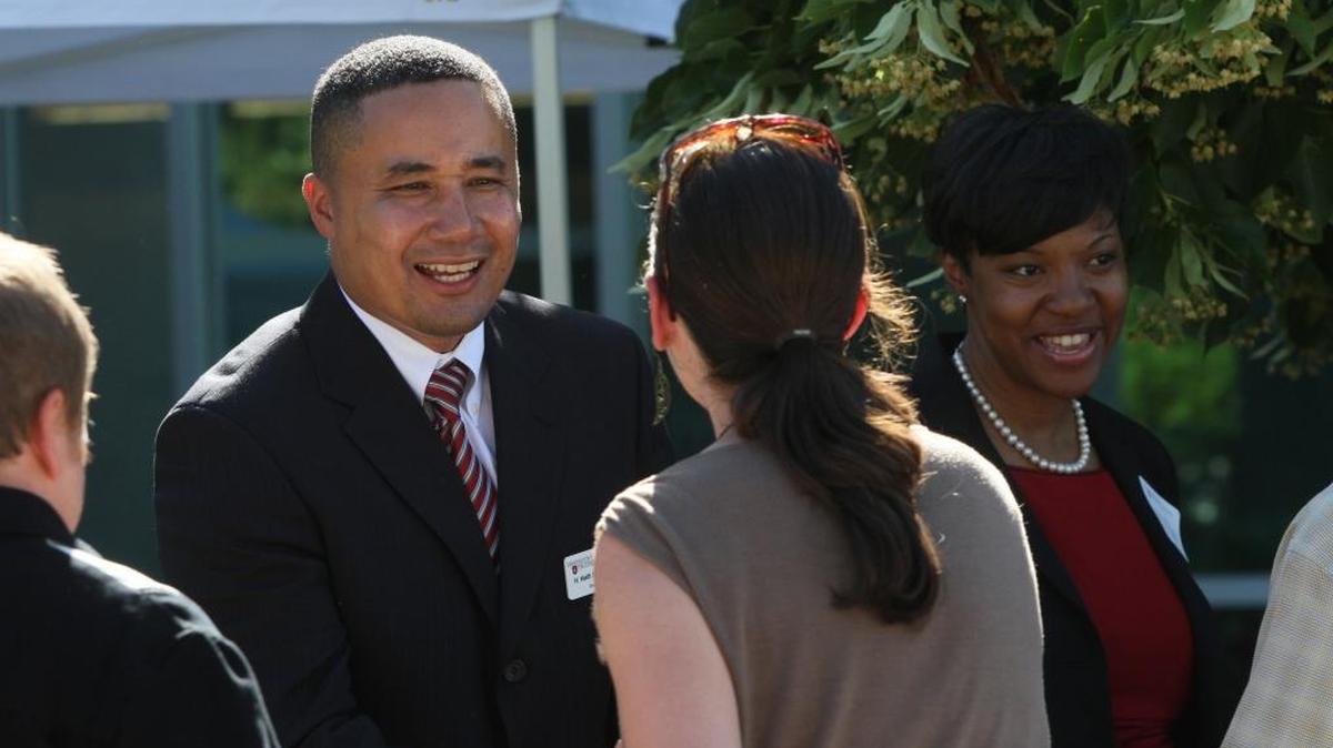 Washington State University Tri-Cities Chancellor H. Keith Moo-Young and his wife Monika, right, greet staff and visitors during a community reception shortly after he was picked to lead at WSU Tri-Cities.