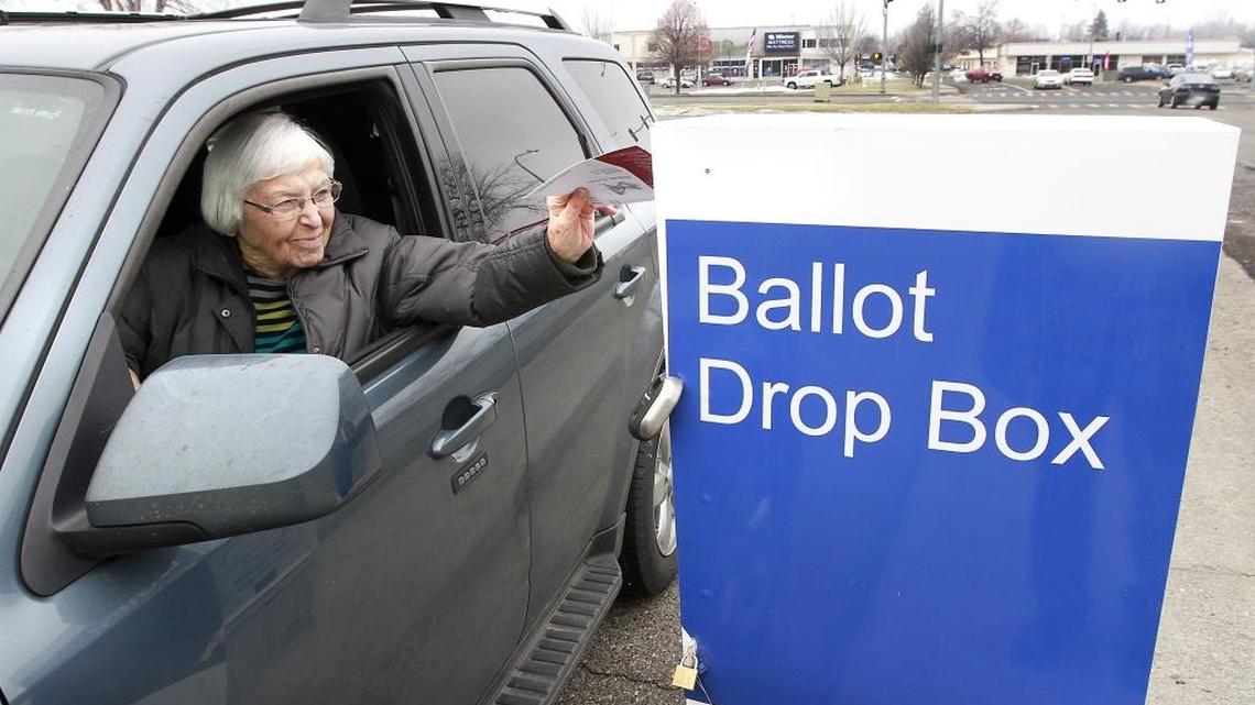 Richland resident Marion Morey uses the drive-up ballot drop box Tuesday afternoon at Jefferson Park on Symons Street to turn in her ballot for the school bond election. Richland school officials were asking voters to approve a $99 million bond.