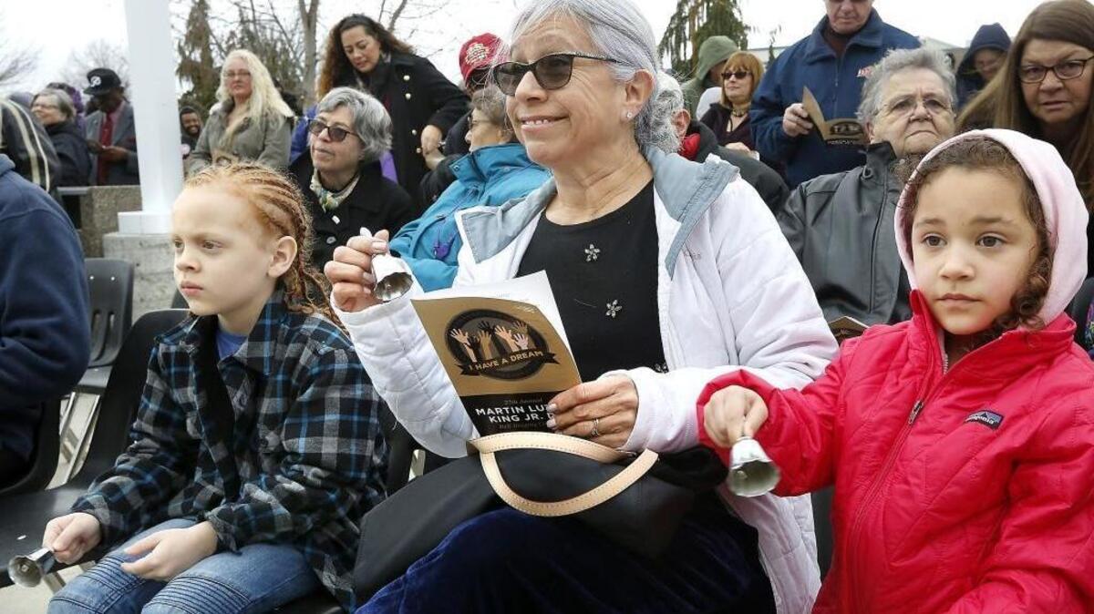 Suzi Nettles of Pasco is joined by two of her grandchildren, Marques, 7, left, and Harper, 5, during Monday’s 27th annual Martin Luther King Jr. Day Bell-Ringing Ceremony at Columbia Basin College in Pasco. Several hundred people attended the event that started with an outdoor ceremony before moving indoors. Watch a video at: tricityherald.com/video