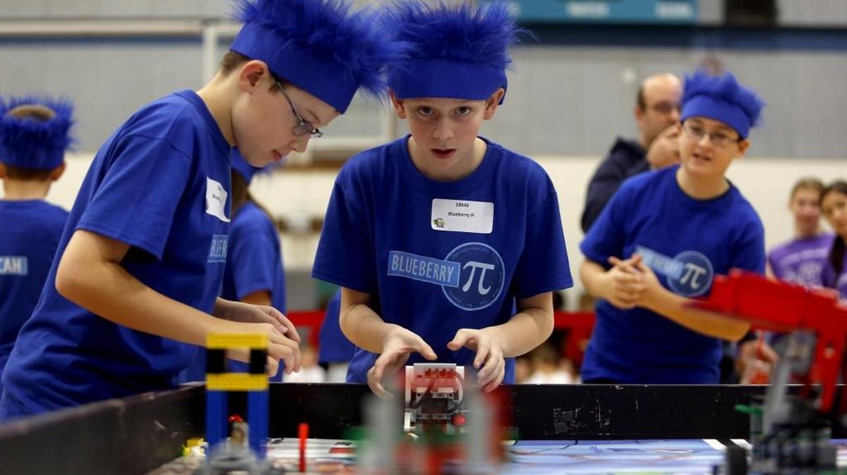 Blueberry Pi teammates Rex Wright, right, and Nate Shelton, both Richland sixth-graders, react as their Lego robot moves through the “Trash Trek” challenge course Saturday during the FIRST LEGO League Tri-Cities regional tournament at Chief Joseph Middle School in Richland. More than 300 local students competed in the 10th annual tournament. Teams spent the last few months programing a Lego robot to solve the challenge of cleaning up trash as well as presenting real-life ideas on trash collection, sorting, smart production and reuse. See a video at www.tricityherald.com