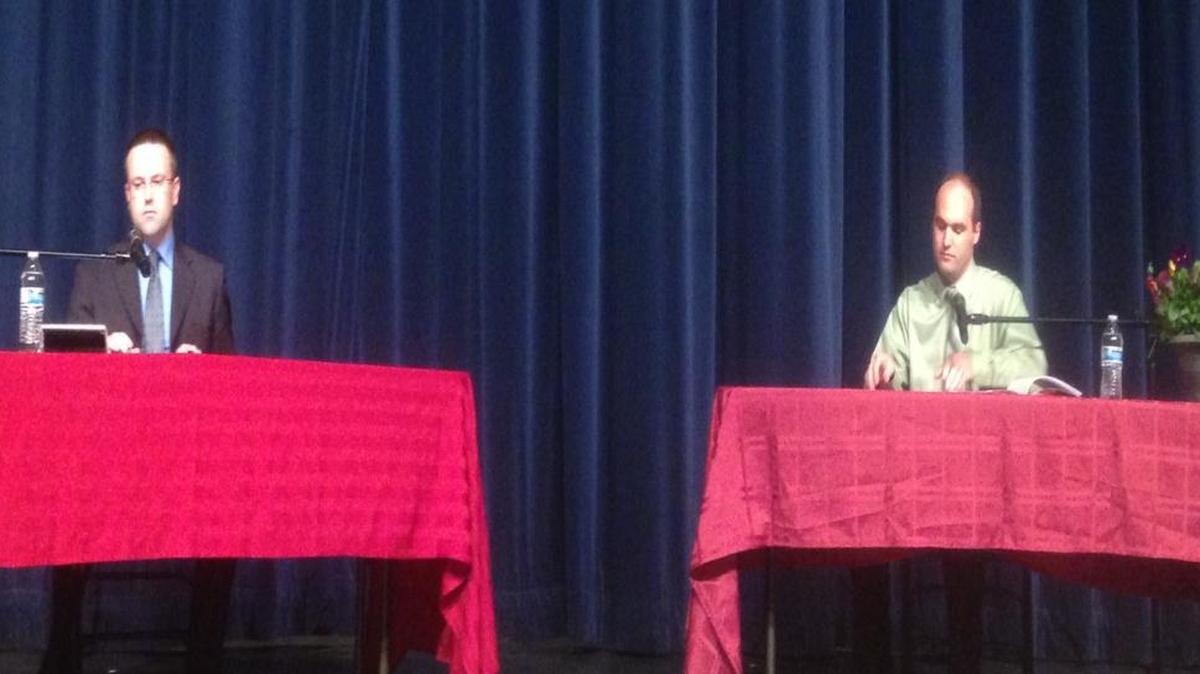 
Pasco School Board President Ryan Brault, left, and his challenger, Aaron Richardson, await questions during a debate Thursday night at Chiawana High School.
