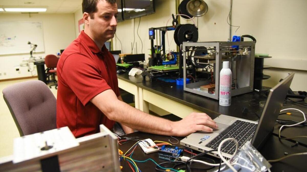 Cameron Hohimer, a doctoral student at Washington State University Tri-Cities, works at the university’s north Richland campus. Hohimer is one of five WSU students to recently receive fellowships from the National Science Foundation.