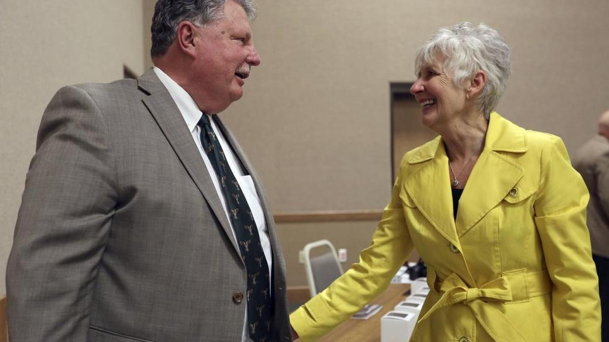 Bruce Hawkins, superintendent of the Educational Service District 123, is congratulated Thursday by Judy Reault, his former assistant superintendent, after receiving the Special Achievement Award during the Crystal Apple Awards at Columbia Basin College. Hawkins is retiring this year from the position as superintendent he started in 2003 and has a public education career spanning 42 years. See more photos at www.tricityherald.com.