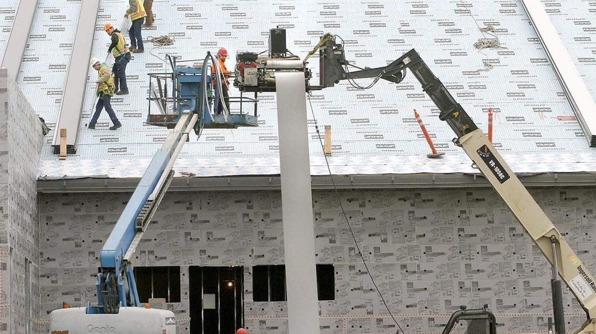 The Pasco School Board will consider placing a $69.5 million bond request on the ballot on Feb. 14, 2017. If approved, it will trigger a fresh round of new school construction. Above, workers install a roof at Marie Curie STEM Elementary School, funded by a bond approved in 2013.