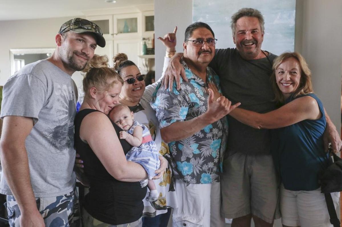 Justin’s Elzinga’s family gathers for a photo with Bobby Nakihei in 2017. The heart and kidney of Justin, 20, of Kennewick, were donated to Nakihei, who has died of complications of COVID-19.
