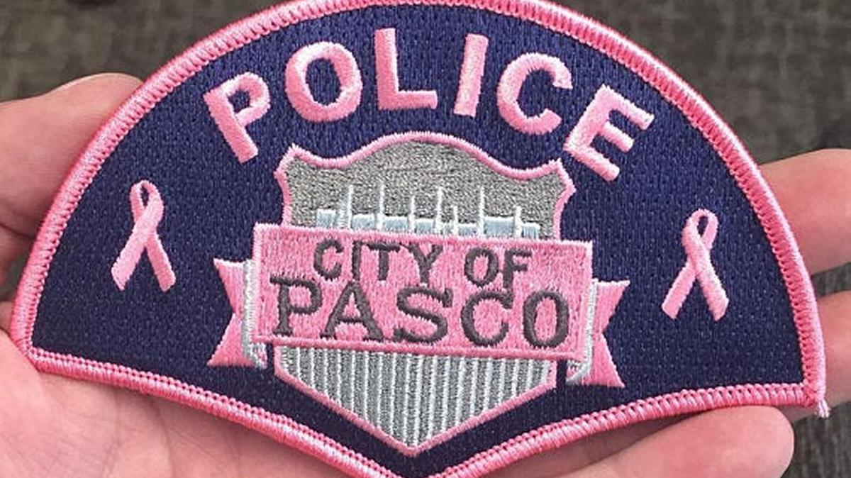 Several Pasco police officers donned the pink patches to raise awareness about breast cancer.