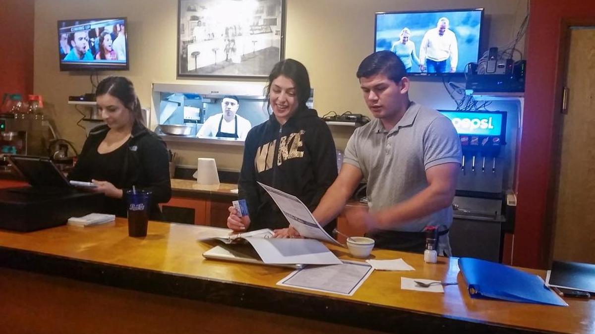 Melissa Brito, center, is fronting the new IDK Restaurant at 355 W. Columbia Drive in Kennewick for the owners, Jose Brito and Germen Alvarez. The restaurant opened Monday.