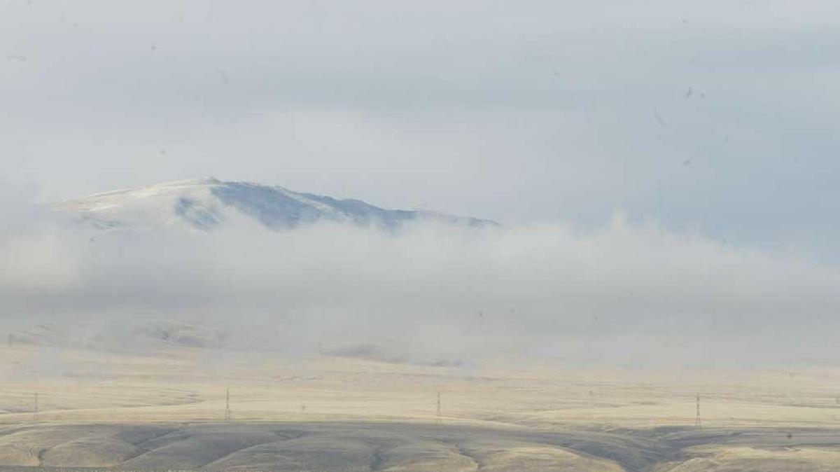 Rattlesnake Mountain near Richland is seen in mid-winter rising above the clouds.