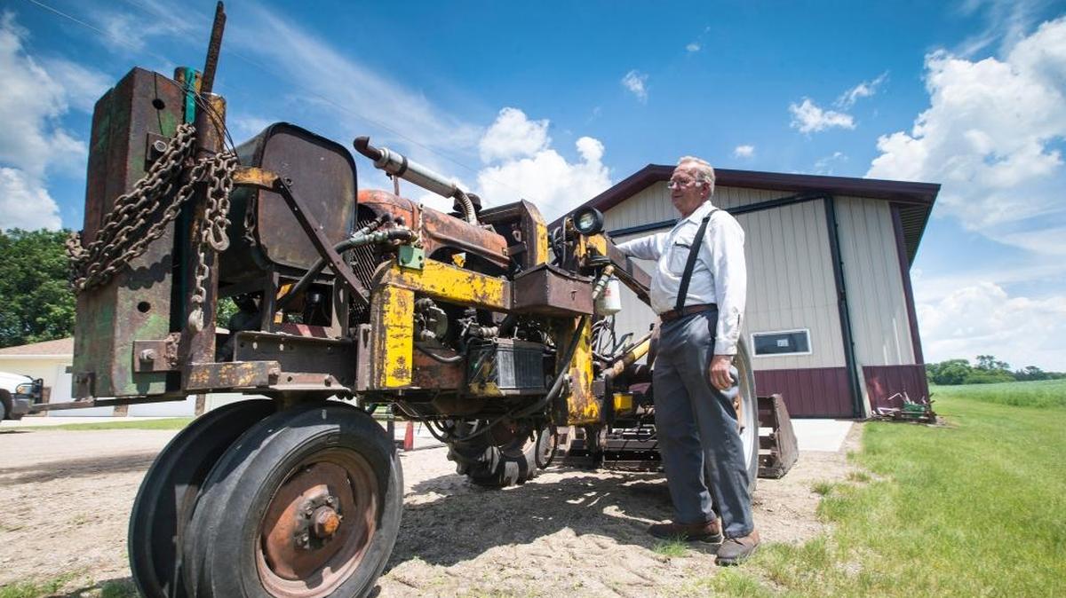 The 1947-model Allis Chalmers tractor re-engineered by farmer Duane Fuglie, pictured, is photographed on Tuesday, June 23, 2015, in Ulen, Minn. The tractor killed 24-year-old Jake Fuglie, who tipped it while plowing snow.