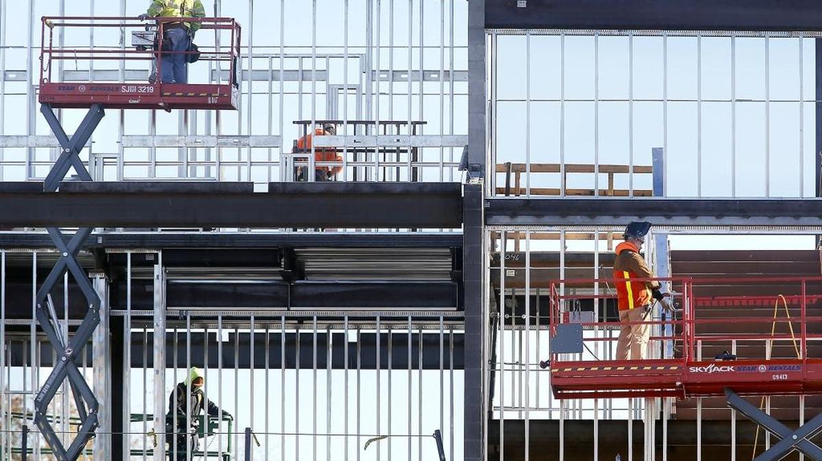Construction workers appear to be boxed into their work areas while using scissor lifts at varying heights Friday morning at the new Jefferson Elementary School building in Richland. The 65,000-square-foot replacement school will house about 540 students and is being built adjacent to the existing school. The construction project was part of the district's $98 million 2013 bond. Plans also include renovating the 1982 wing of the existing Jefferson to house preschool programs.