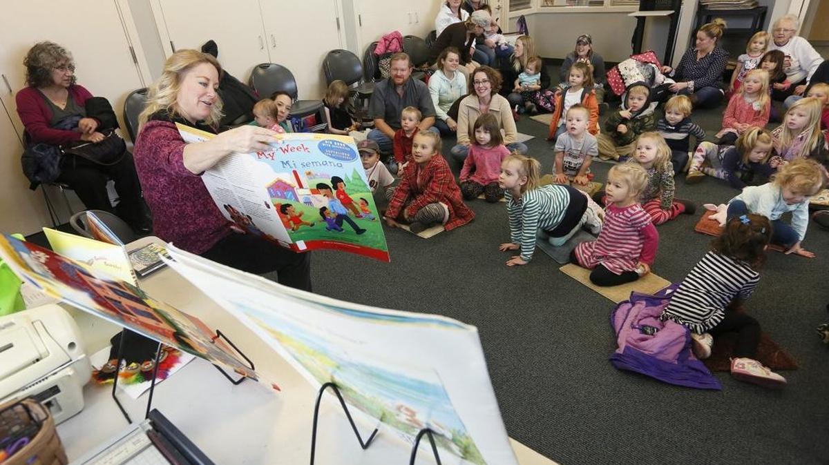 In this file photo, Susan Sheets, a customer service specialist at the West Richland branch of the Mid-Columbia Libraries, reads to children during story time.