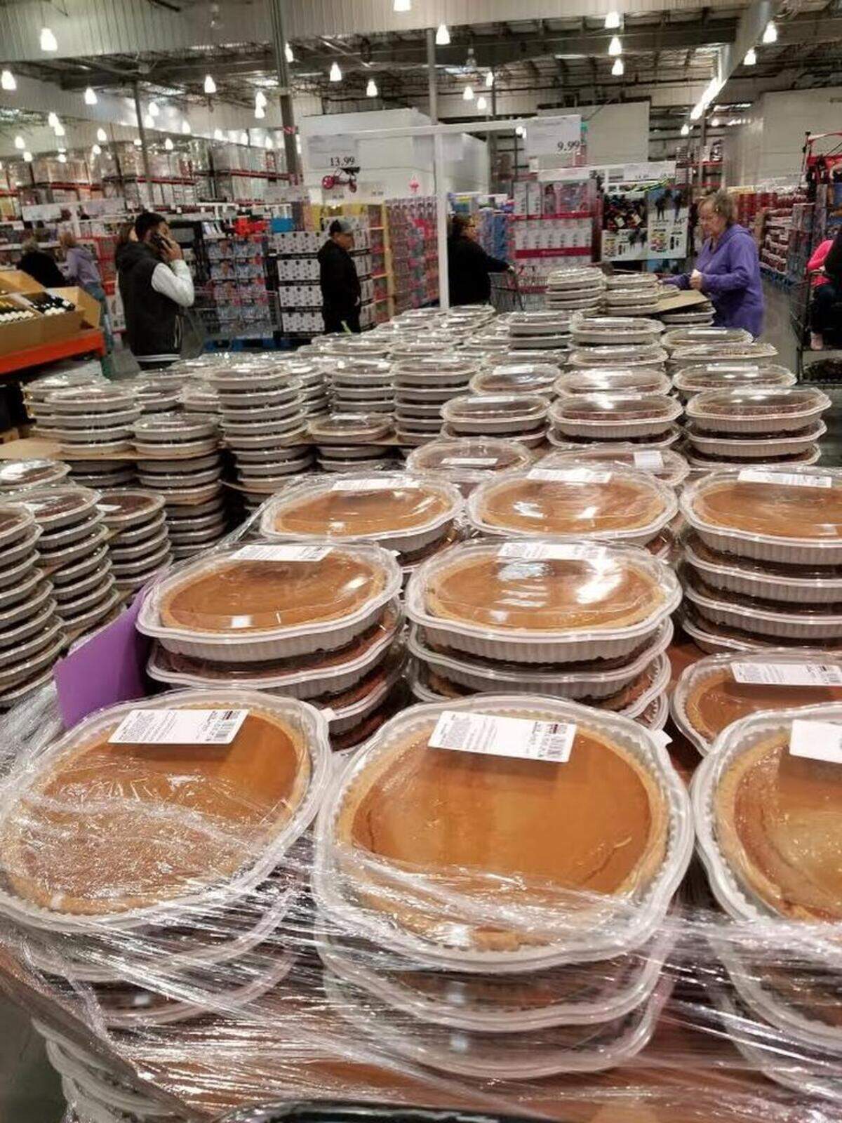 A shopper picks out a pumpkin pie at Costco in Kennewick.