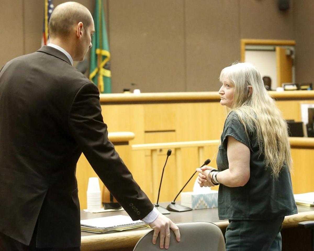 Murderer Theresa Wiltse talks with her attorney Caleb DiPeso before leaving Benton County Superior Court on Friday morning after being sentenced to life in prison for the death of Sandra Harris of Kennewick.