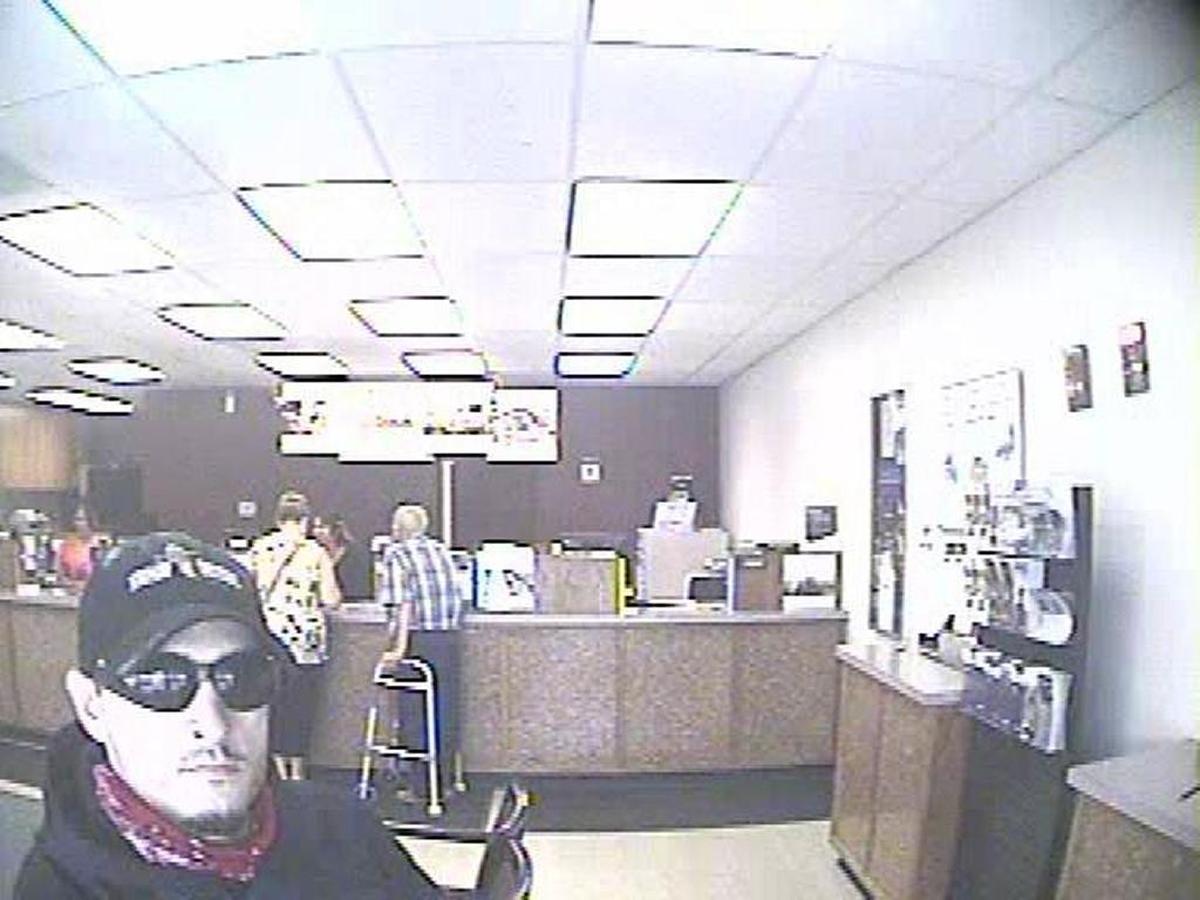 This photo was taken from inside the Granger branch of U.S. Bank on Monday. Police say the man in the lower left is Moises Marquez.