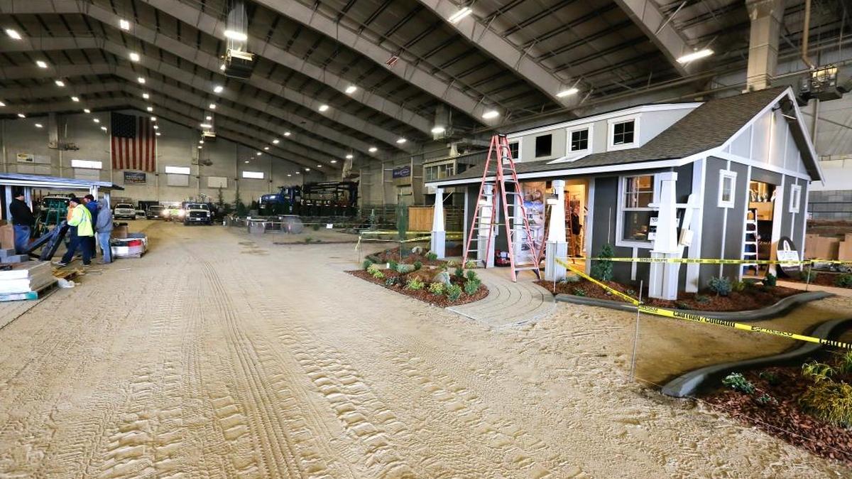 The Home Builders Association of Tri-Cities, prepare for Home and Garden show on Wednesday at the TRAC center in Pasco. The Home Builders Association of Tri-Cities and Franklin County, which owns TRAC, are finalizing a deal to pave the dirt floor of the venue’s rodeo arena.