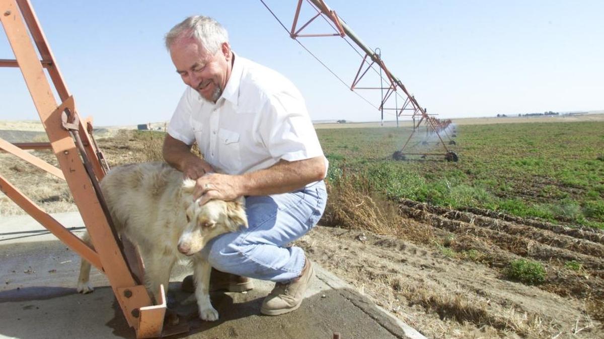 Ron Reimann, president of the Port of Pasco Commission, died Sunday night when a van struck the ATV he was riding near T&R Farms in Franklin County. This photo was taken on his farm in 2001.