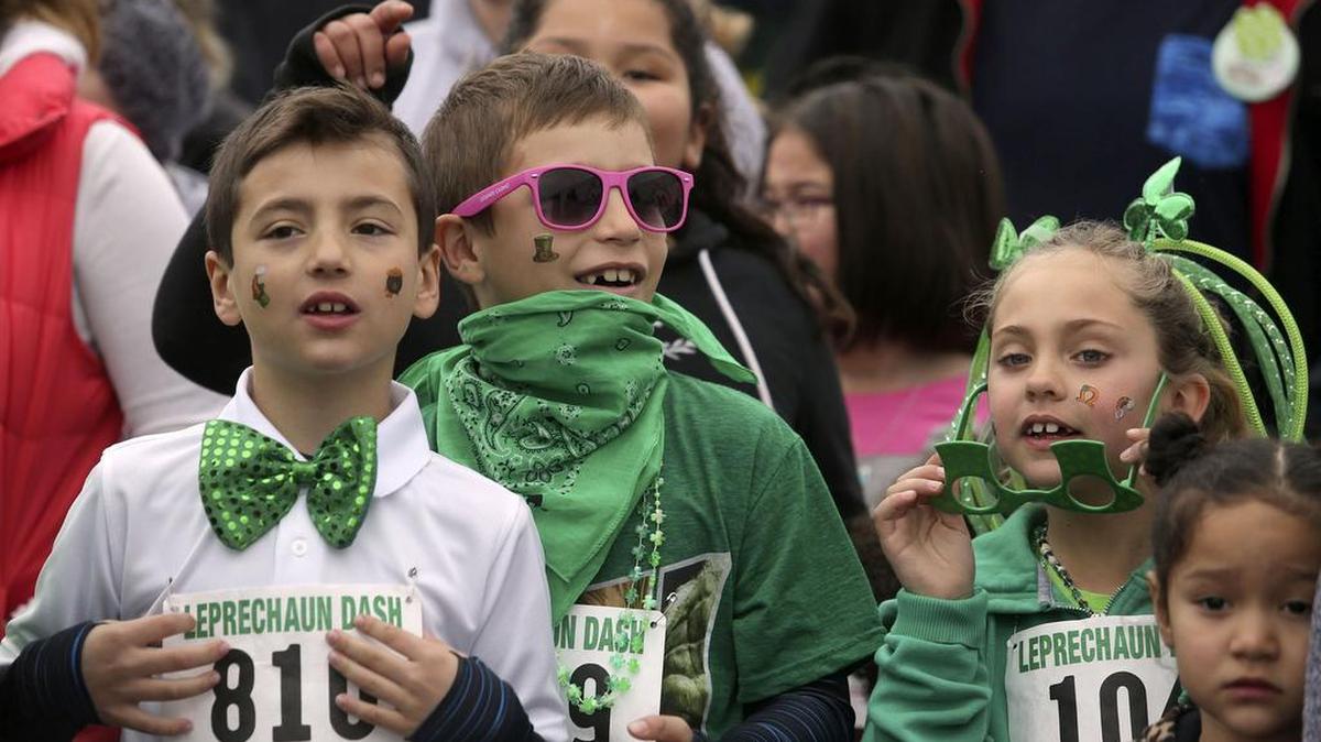 From left, cousins Frankie, 9, Angelo, 8, and Maddalena and Kassidy Sweet, 7, warm up Saturday as they wait to start the Leprechaun Dash at Columbia Park in Richland. Race officials estimated 1,400 kids and 700 adults participated in this year’s Dash and St. Patrick’s Day Foot Race. See more photos at www.tricityherald.com.