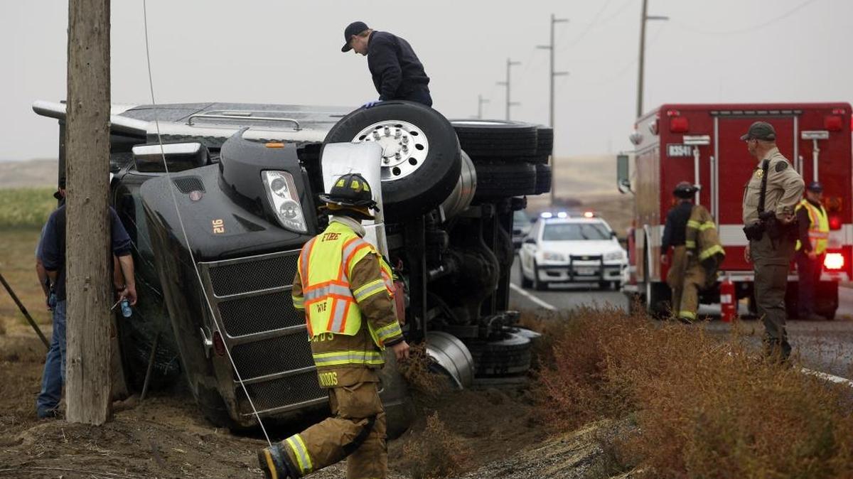 
There were no injuries Wednesday afternoon when a semi-truck carrying apples drifted off the shoulder of the road, tipped over and hit a high tension power line while traveling westbound on Highway 124 near Burbank.

