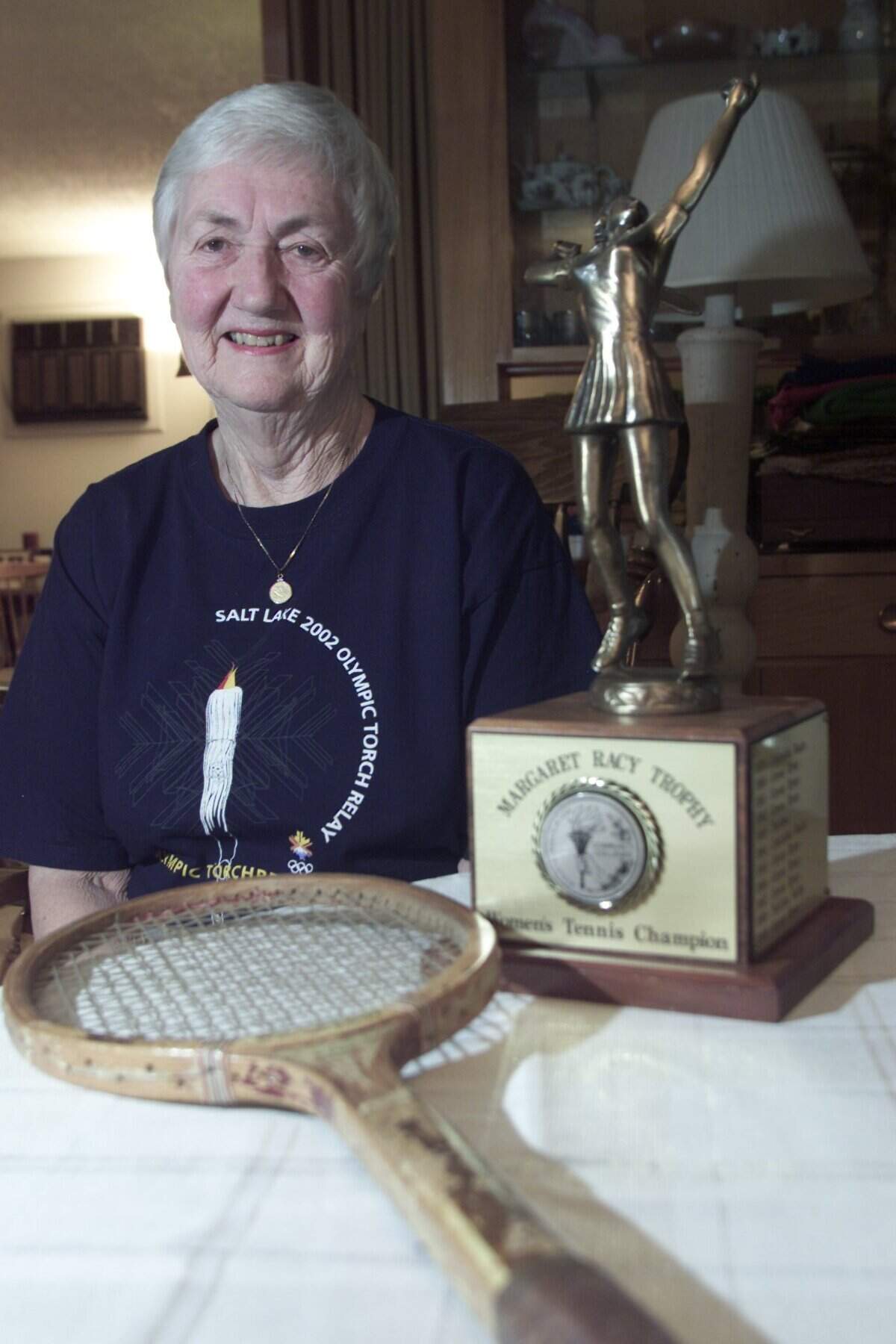 Margaret Racy was one of 27 to carry the Olympic flame through the Tri-Cities in 2002. She coached many sports including basketball, volleyball and tennis.