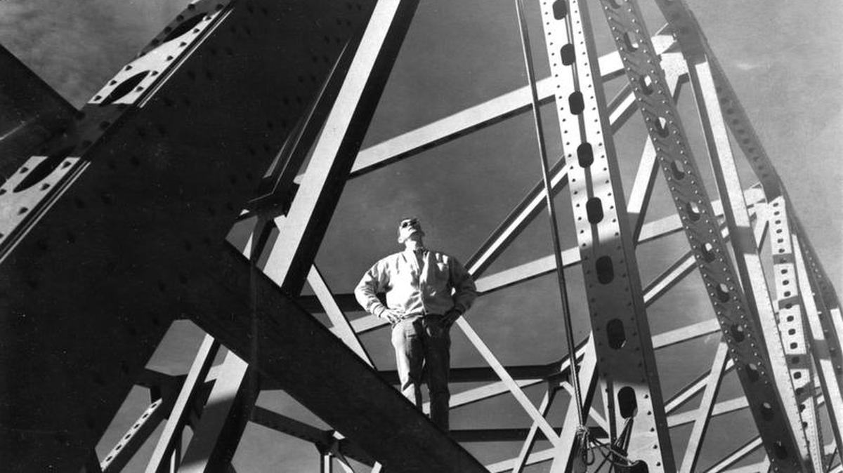 High above the traffic on the blue bridge between Pasco and Kennewick, Owen Kastning, state highway inspector, makes a last-minute check for spots needing sandblasting in this Tri-City Herald archive photo from March 1963. Kastning was in town to supervise the We Construction Company of Kirkland, which had the contract to give the bridge a new coat of paint