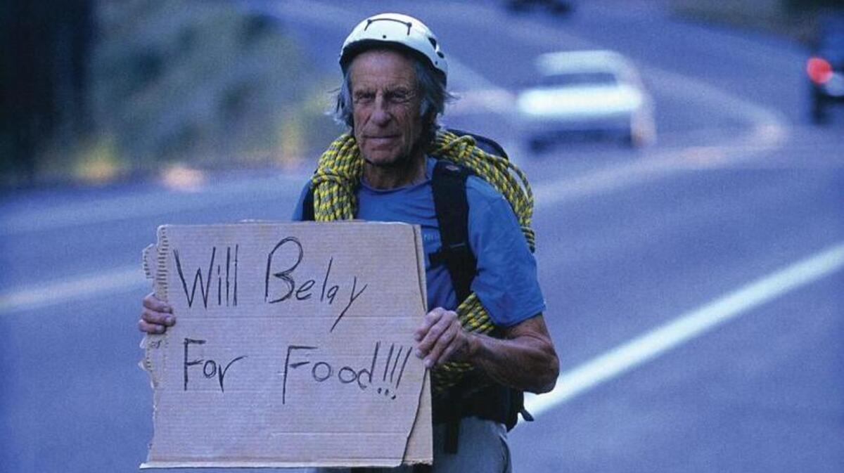 Fred Beckey hitching a ride, mountain-climber style.
