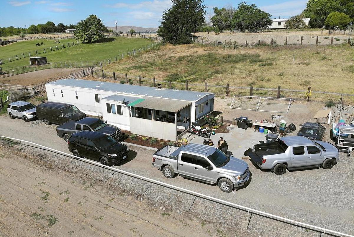 June 14, 2018 - Law enforcement officers, led by the Drug Enforcement Administration, search a mobile home in Finley. Officials said the bust was related to a drug investigation involving the illegal use of fentanyl.