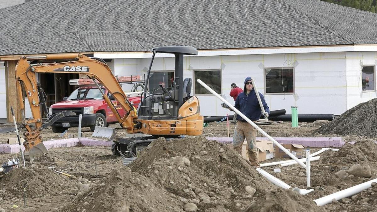 Caleb Bork, an employee of Aarrow Plumbing of Pasco, works inside the concrete foundation of the Mid-Columbia Meals on Wheels kitchen Thursday, installing drain pipe for the new facility at 1824 Fowler Street in Richland. The 2.2-acre campus also is the new site for the administration offices building for Senior Life Resources, which operates the meals program for seniors. A benefit breakfast to help purchase equipment for the new kitchen facility is being held Feb. 24 by Steven Simmons of Country Gentleman Restaurant and Catering at the TRAC facility in Pasco. The public is invited to attend, but people are asked to RSVP by Feb. 22 by calling 509-735-1911. Watch a video at www.tricityherald.com