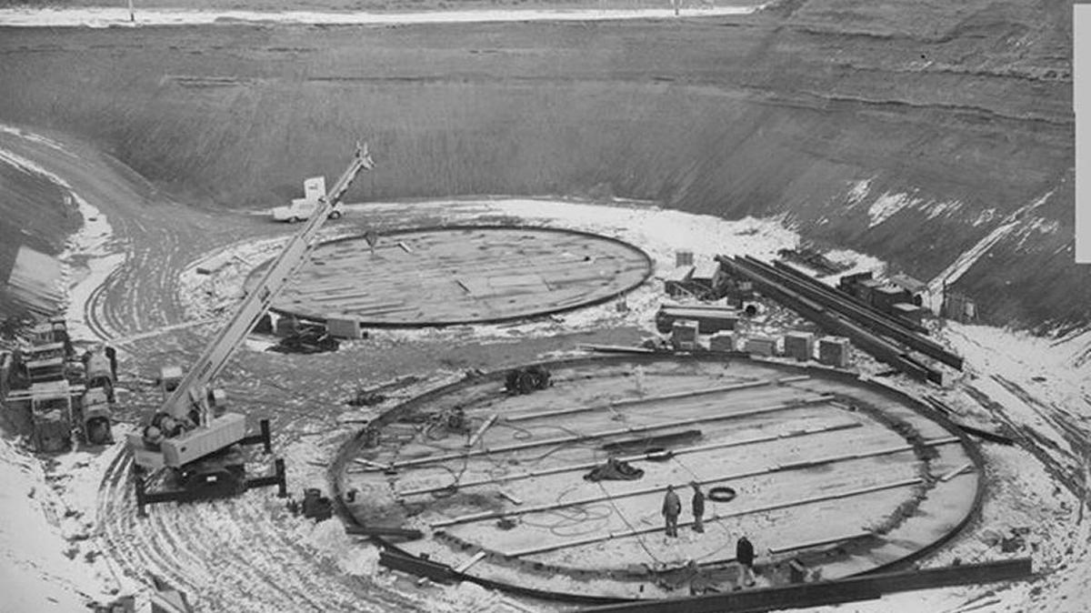 Construction was underway on Hanford double-shell Tank AY-102, in the foreground, in 1969. The first double-shell tank to be built, it now has a leak between its shells. Hanford workers started pumping waste from the double-shell tank Thursday, beating a state of Washington deadline by one day.