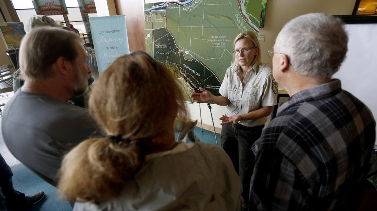 
Heidi Newsome, wildlife biologist with the U.S. Fish and Wildlife Service, talks to members of the public Thursday during an open house regarding public access to Rattlesnake Mountain at the Reach in Richland. Public comments regarding access will be taken until Nov. 13 and can be emailed to hanfordreach@fws.gov.
