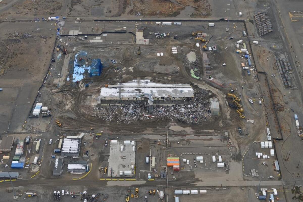 The Plutonium Finishing Plant is shown in the first week of November. The area where water and fixative is mixed is near the upper lefthand corner of the photo and the area where waste is loaded out is on the other side of the photo above the right end of the main part of the plant that remained standing in November. Workers might have been exposed to airborne radiological particles in both locations.