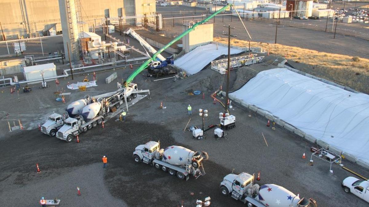 Workers have finished filling with grout a partially collapsed tunnel holding radioactive waste at the Hanford nuclear reservation. The concrete-like grout was injected into the top of the tunnel with a pumper truck.