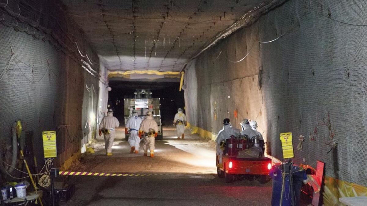Workers move waste underground at the Waste Isolation Pilot Plant near Carlsbad, N.M.