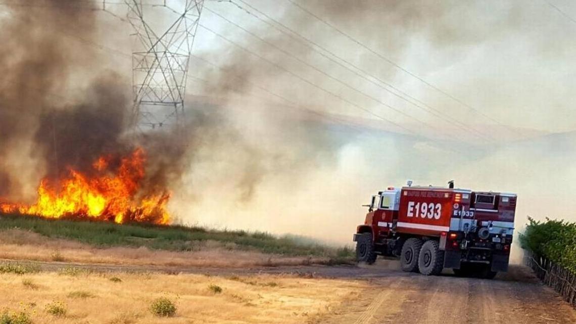 The Hanford Fire Department fights the Silver Dollar Fire north of the Hanford nuclear reservation in early July.