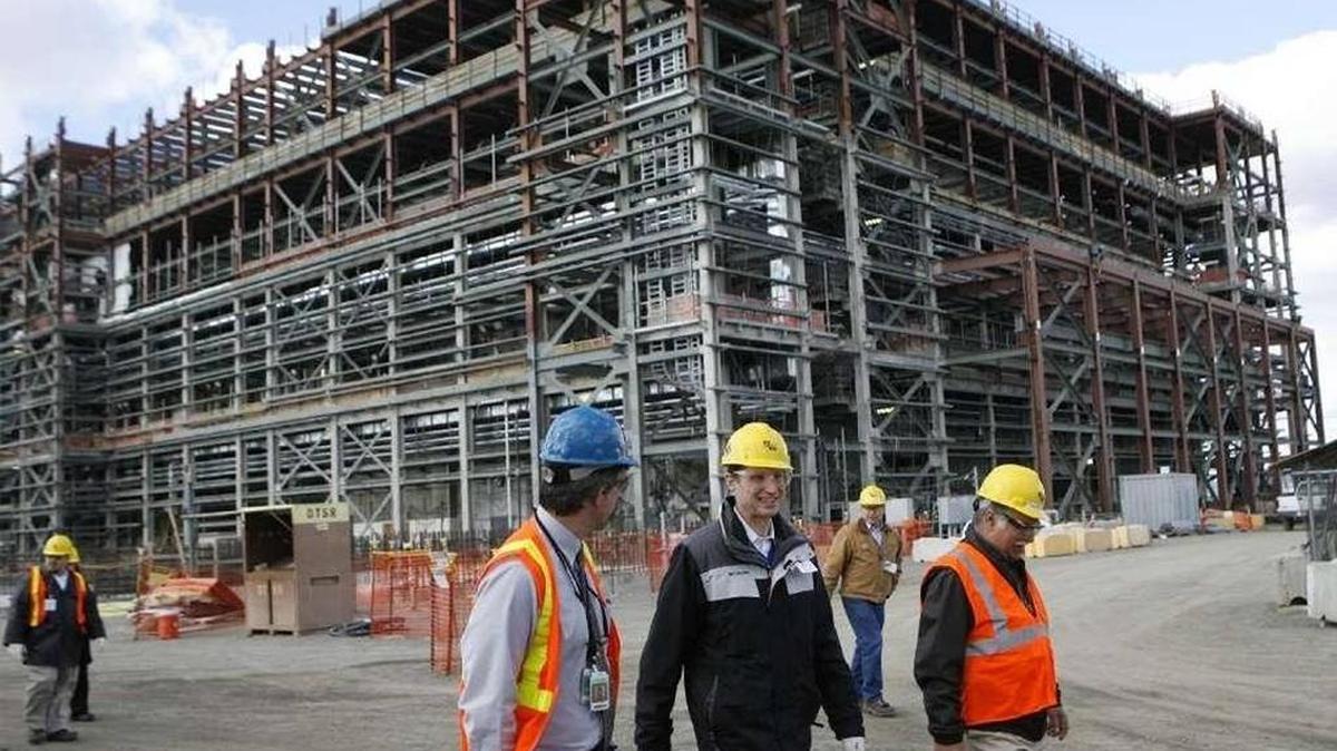 Sen. Ron Wyden, D-Ore., seen in the center wearing black, tours Hanford’s vitrification plant in 2013.