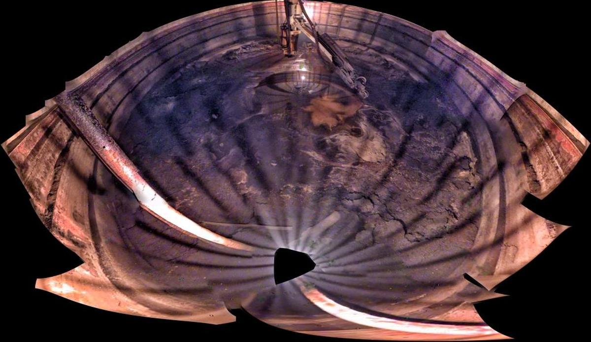 A composite photo shows the interior of Hanford single shell Tank C-105 and the estimated 30,000 gallons of waste the tank still holds.