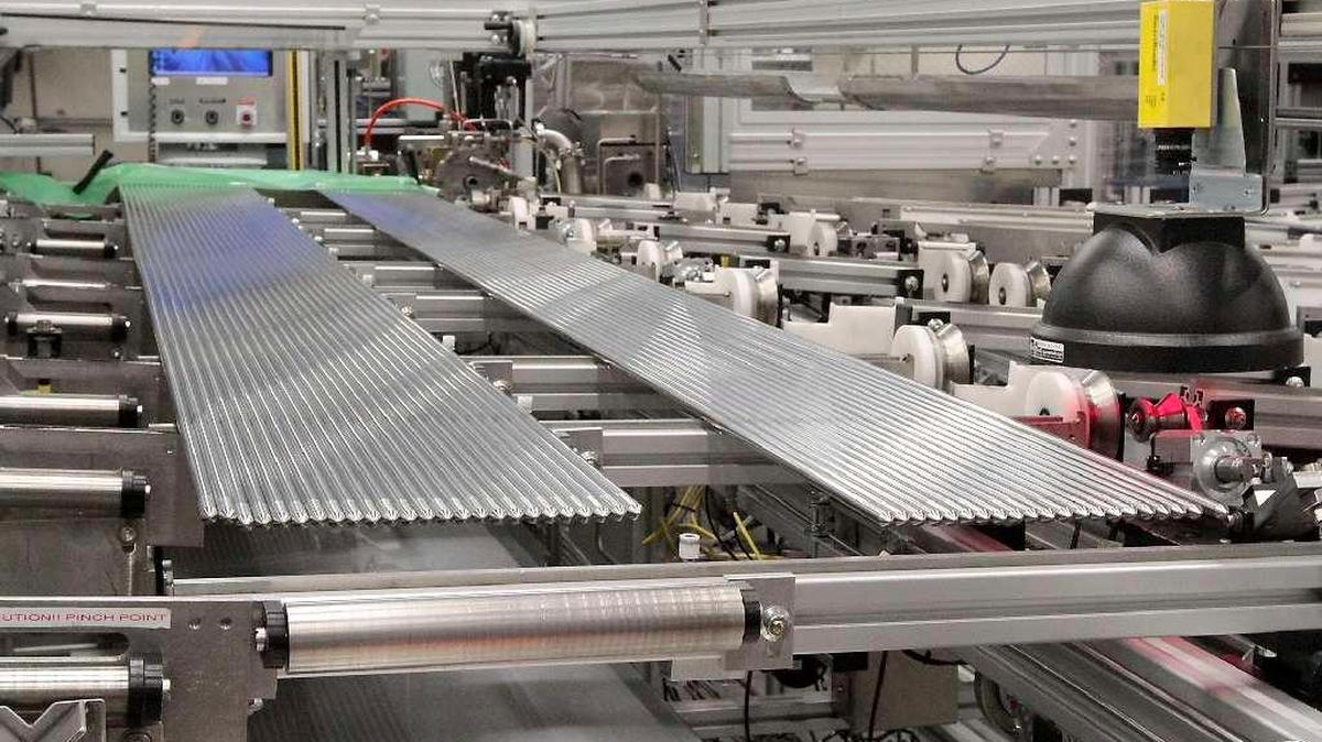 Nuclear fuel rods sit on a vibratory rod loading table at the Areva manufacturing plant in Richland.