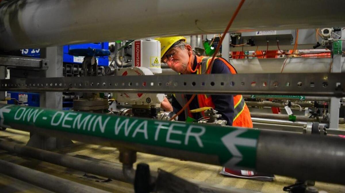 An employee at the Hanford vitrification plant project inspects piping in one of the plant’s support facilities, the water treatment building, as preparations are made to glassify radioactive waste by 2022.