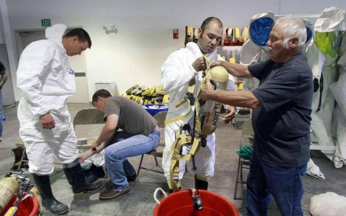 Trainees put on protective clothing and breathing equipment at the HAMMER training center, managed by Mission Support Alliance at Hanford.