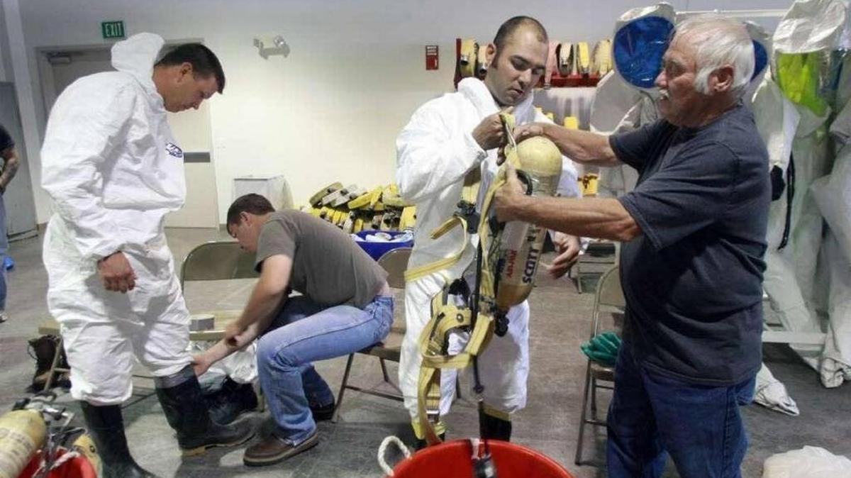 Trainees put on protective clothing and breathing equipment at the HAMMER training center, managed by Mission Support Alliance at Hanford.