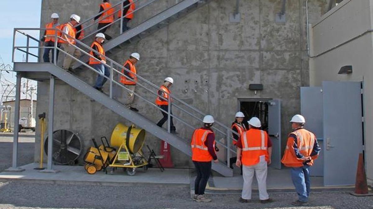 The “Real ID” act will change identification requirements for the badges issued to visit secure parts of the Hanford nuclear reservation. The Hanford Advisory Board toured the new sludge transfer annex at the K West Basin in 2015.