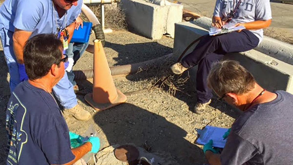 Samplers and safety professionals check the status of the soil vapor extraction monitoring wells in central Hanford before the project was declared completed.