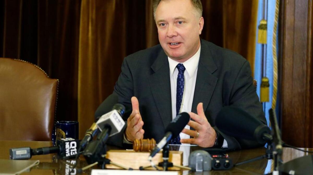 Washington Sen. Doug Ericksen, R-Ferndale, talks to reporters Thursday at the Capitol in Olympia. Ericksen is currently serving as both a state senator and a member of President Donald Trump's transition team.