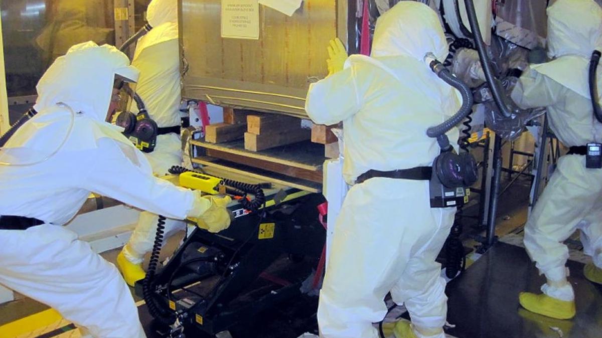 Hanford workers separate highly contaminated glove boxes from their connection points in Hanford’s Plutonium Finishing Plant. The Department of Energy has a legal deadline to have the plant demolished this year.