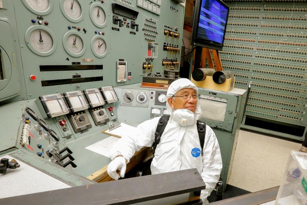 Mitsugi Moriguchi sits at the control center inside Hanford’s B Reactor on Friday. Moriguchi took a private tour on the reactor, which produced plutonium for the atomic bomb dropped on Nagasaki. Moriguchi was a child at the end of World War II.