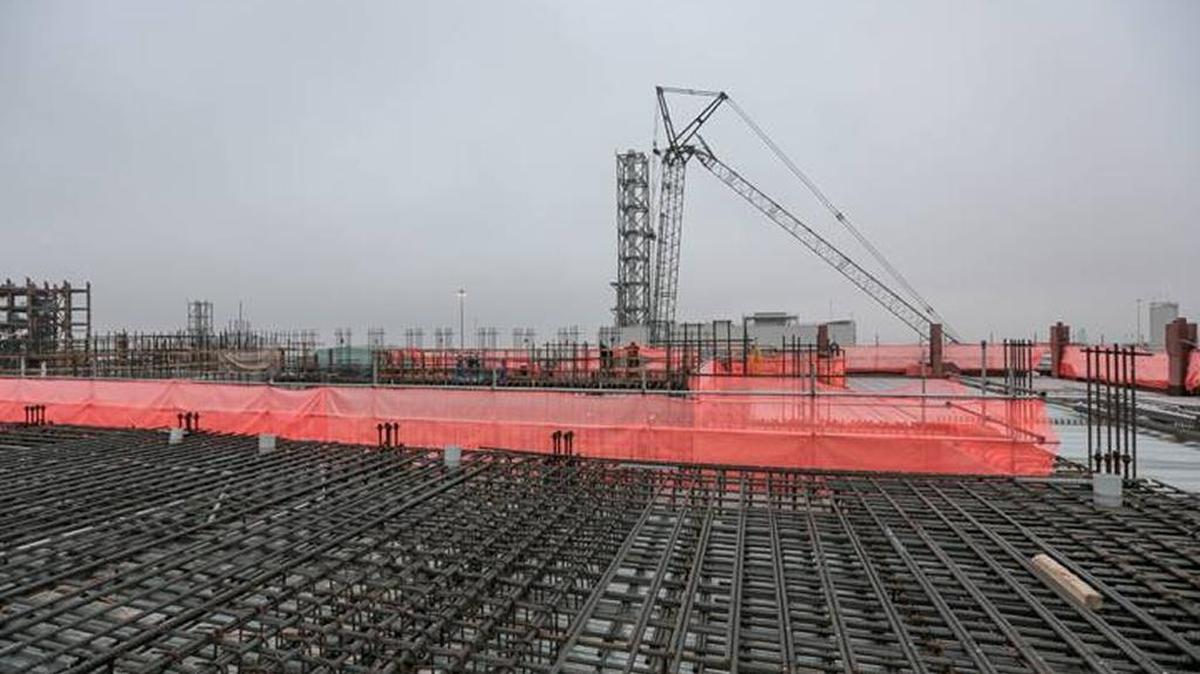 Rebar flooring is installed at the top of the Hanford vitrification plant’s High Level Waste Facility on a foggy day.