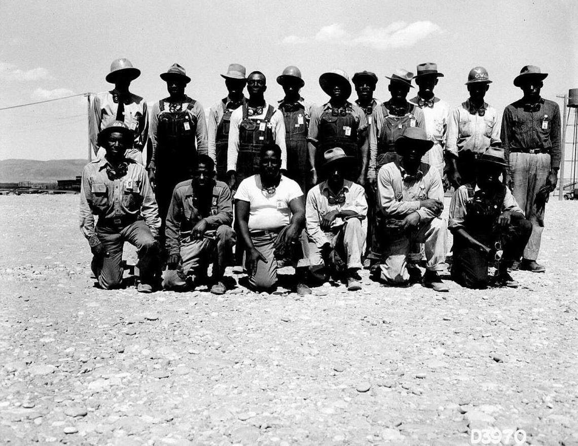 A group of construction workers pose for a photo at the Hanford nuclear reservation during World War II.