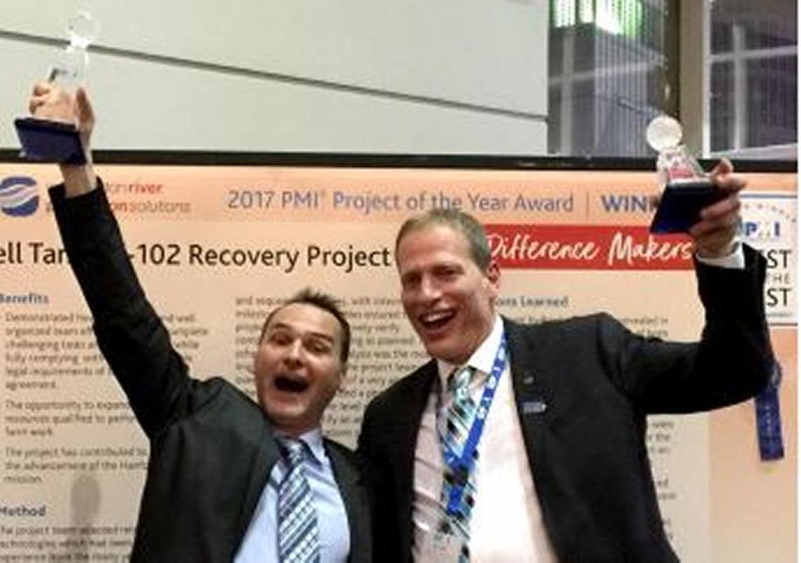 Sebastien Guillot and Doug Greenwell, both of Washington River Protection Solutions, celebrate receiving the Project Management Institute Project of the Year award.