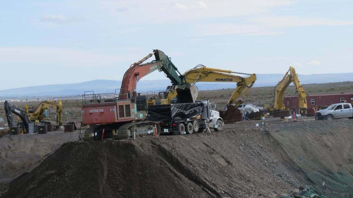 Contaminated soil at Hanford’s 618-10 Burial Ground is loaded into containers on Thursday to be taken to a central Hanford landfill. The soil was near vertically buried pipes filled with waste that have been cleaned up.